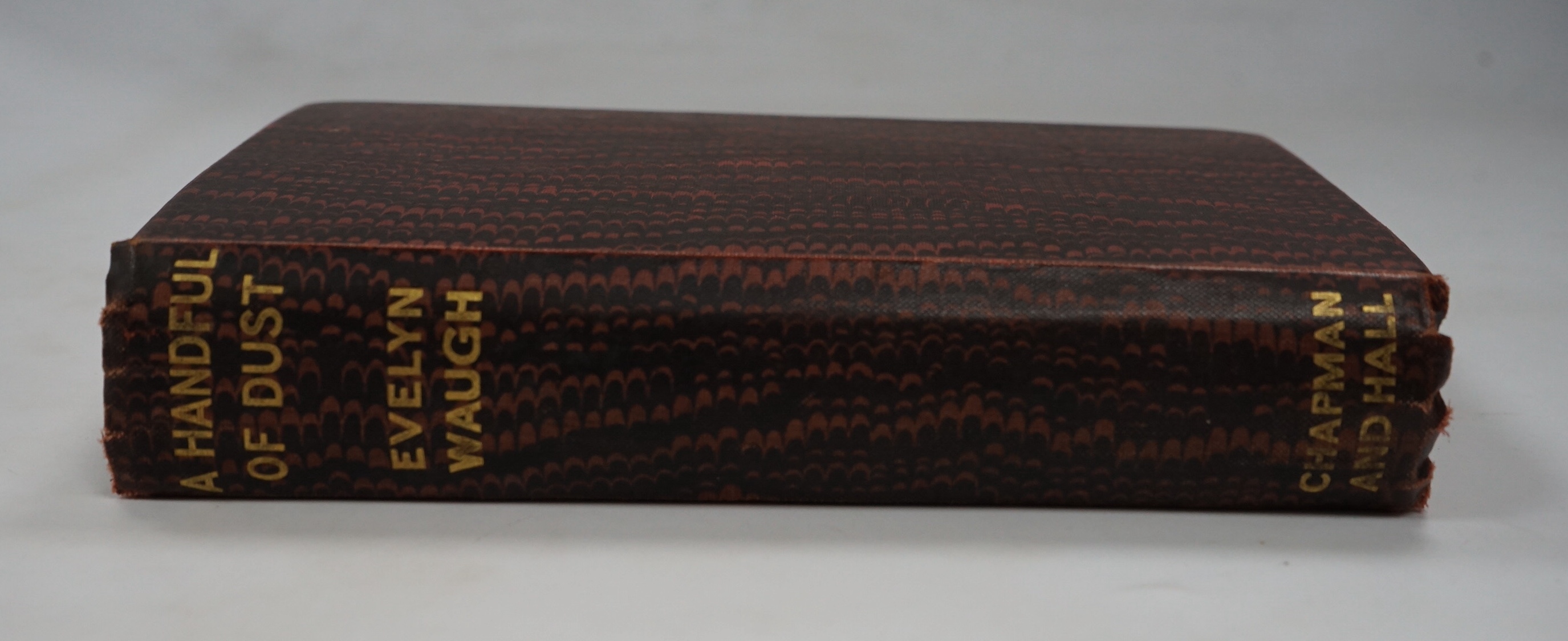 Waugh, Evelyn - A Handful of Dust, 1st edition, Chapman & Hall 1934, light marginal browning to text and endpapers, original cloth